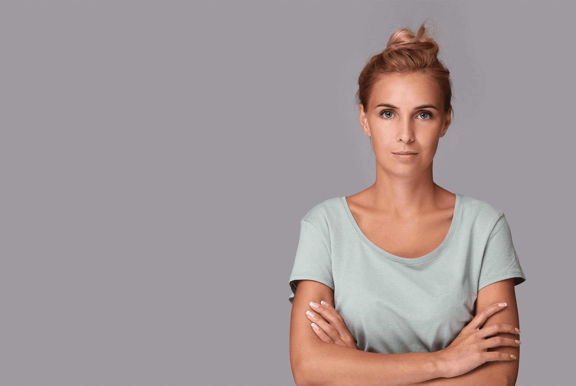 Woman standing with arms crossed representing civic determination
