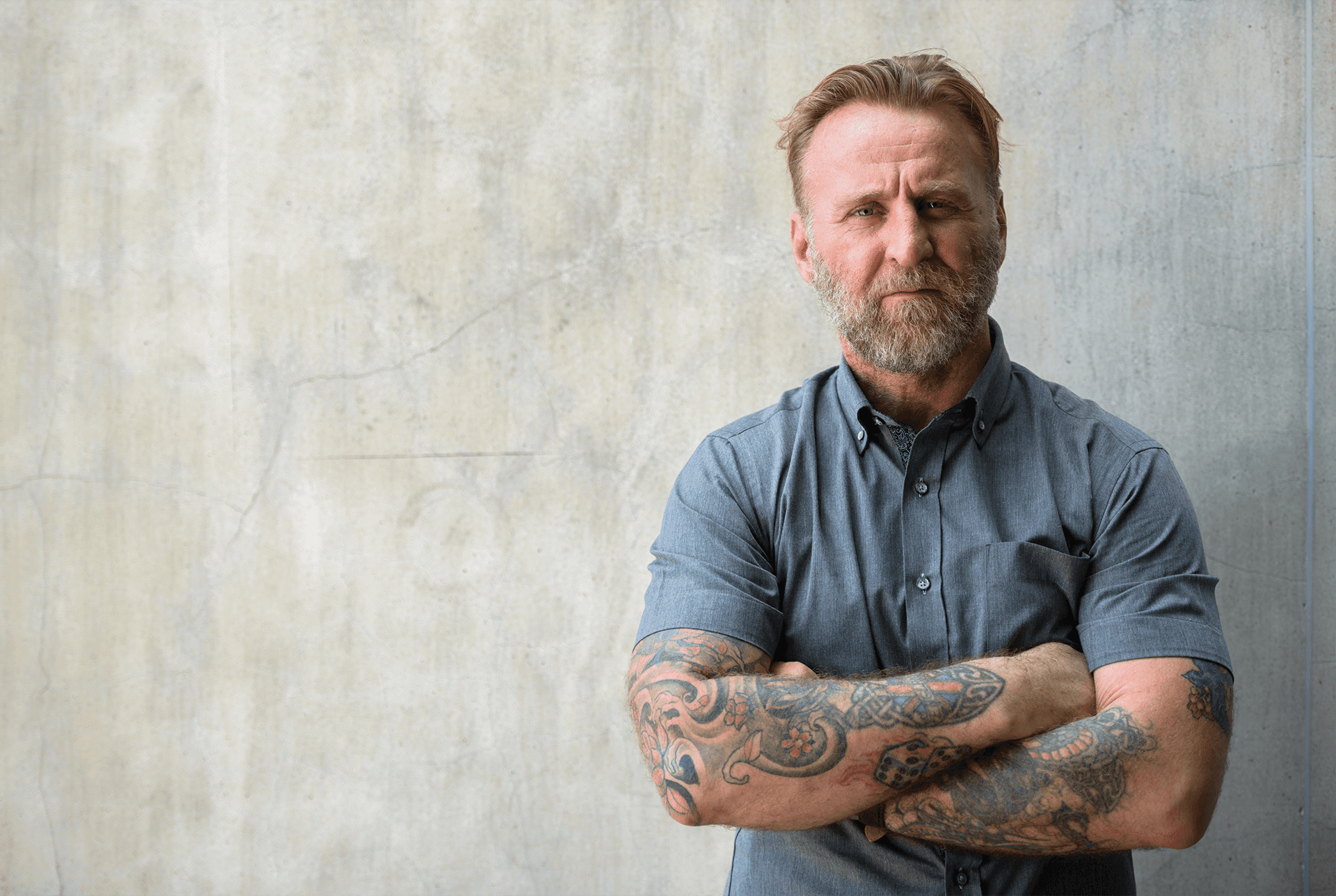 Determined American standing with arms crossed